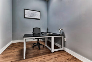 private office space for monthly membership fee with two tables and chairs and access to open coworking and ethernet port
